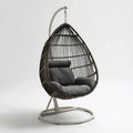 Hamak lub fotel wiszący, Wózek stojący w kolorze czarnym i szarym, stal i rattan 105 x 105 x 195 cm, kształt jajka